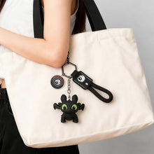 Load image into Gallery viewer, How to Train Your Dragon Merch - Night Fury Dragon Keychain Glow in the Dark Mini Dragon Pendant with Moving Wings - Trendy Bag Charm Car Ornament Keychain Gift
